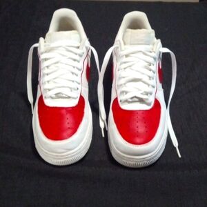The color is white and red. Size is 9   Brand is Nike. Custom shoes.